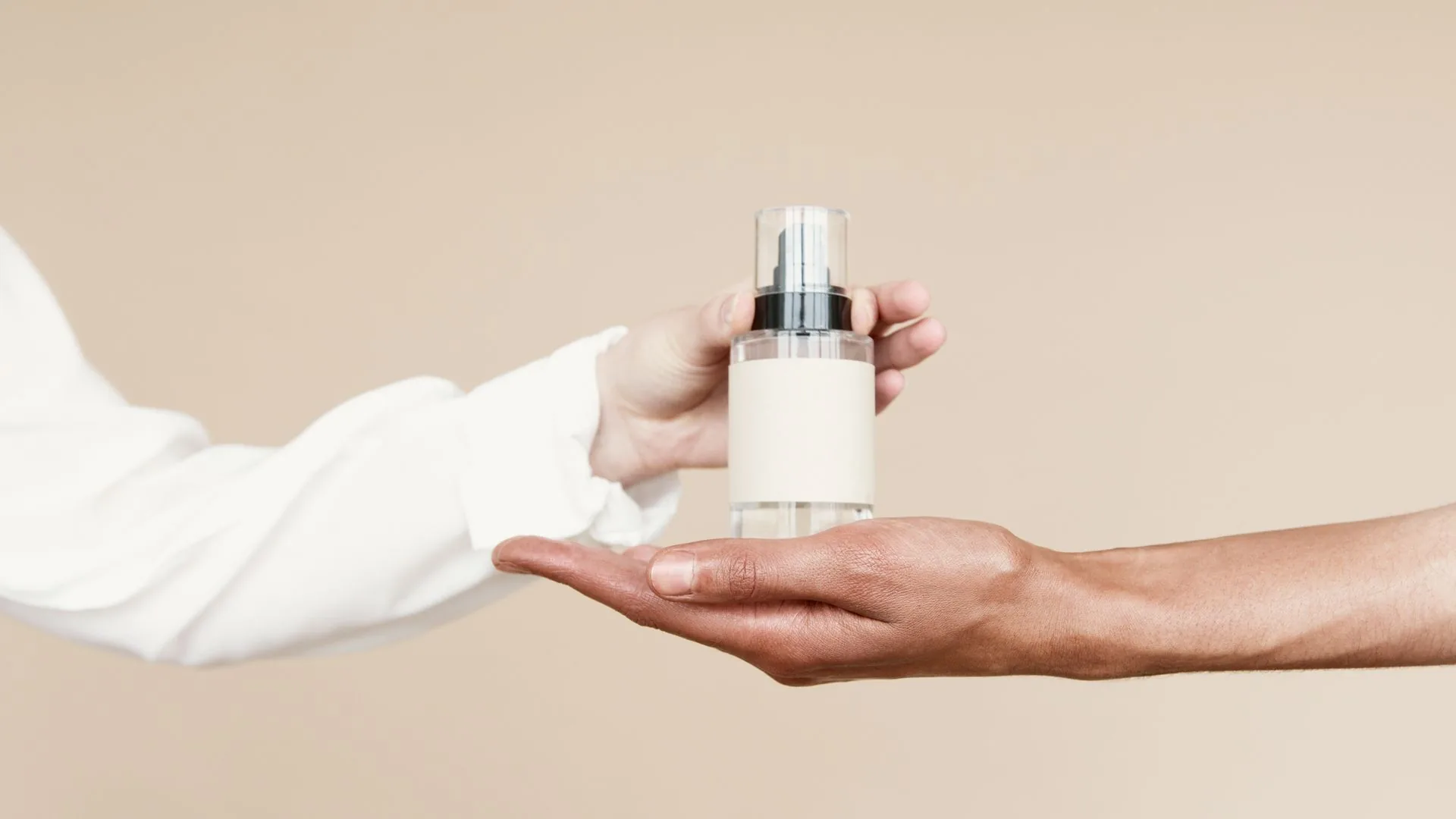 A skincare product held between hands